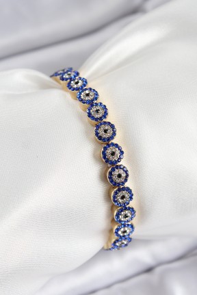 Pirinç Zirkon Taşlı Lacivert Nazar Model Gold Renk Lastikli Kadın Bileklik Pirinç Zirkon Taşlı Lacivert Nazar Model Gold Renk Lastikli Kadın Bileklik