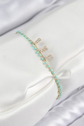 Pirinç Zirkon Taşlı Mavi Boncuklu Model Gold Renk Kadın Bileklik Pirinç Zirkon Taşlı Mavi Boncuklu Model Gold Renk Kadın Bileklik